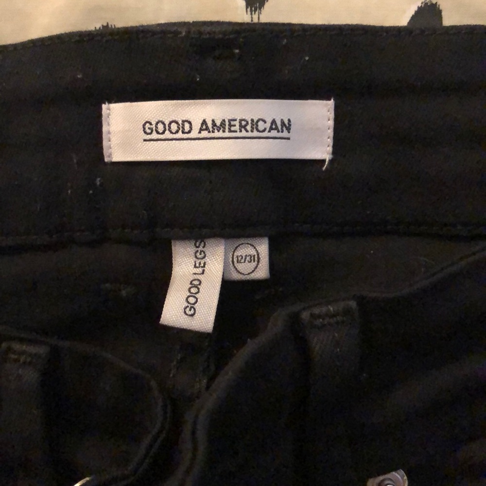 Good American black jean with fray bottom